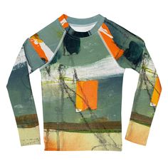 a green and orange shirt with an abstract painting on it