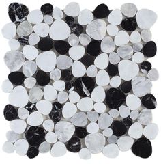 a black and white marble tile with circles in the shape of dots on it's surface