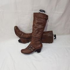 Offering you brown women's leather knee-length boots with round toe. Fashion 90's - 2000's. Vintage boots in boho style, will emphasize the beauty of your legs. Thanks to the elastic band in the upper part, it fits well around the shin. With the buckle, you can adjust the size to fit your shin. Made of soft leather. Comfortable model on a not large, stable heel, will complement any image. In a single copy. Limited edition, in good condition. Materials: leather The circumference calf width - 14 - Fitted Boots With Buckle Closure And Round Toe, Fitted Buckle Closure Boots With Round Toe, Fitted Moto Boots With Buckle Closure For Fall, Winter Fitted Boots With Buckle Closure, Fitted Knee-high Moto Boots For Fall, Winter Fitted Moto Boots With Buckle Closure, Fitted Winter Boots With Buckle Closure, Brown Wide Calf Moto Boots For Winter, Fall Fitted Knee-high Moto Boots