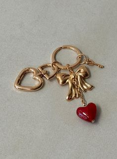 Gold-toned keyring with three removable charms Princess Polly Lower Impact 45% reclaimed zinc alloy 45% reclaimed steel 10% glass Birthday Wishlist, Online Fashion Boutique, Gold Branding, Car Set, Birthday Shopping, Girly Jewelry, Summer Accessories, Floral Dress Black, Gold Charm