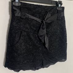 Black Lace, High Waisted Shorts. Has Pockets. Comes With Black Satin Sash. Never Worn. No Tags. Elegant Black Formal Shorts, Elegant Formal Black Shorts, Elegant Short Bottoms For Party, Black High-waisted Shorts For Formal Occasions, Elegant Shorts For Night Out With Short Inseam, Elegant Shorts With Short Inseam For Night Out, Elegant Fitted Shorts For Date Night, Elegant Short Party Bottoms, Elegant Fitted Shorts For Going Out