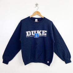 Vintage NCAA Duke University 'Blue Devils' Hoodie Print Logo Blue Color Men's S - Made in Mexico - Materials : Cotton, Polyester  - Tag Reads : S Kindly see the actual measurements (All measurements were taken lying flat) - Actual size manual measurements * Width (Armpit to armpit) : 21 inches * Length (Shoulder to end of garment) : 24 inches * Sleeve length : 22 inches - Condition : * Good condition 8/10 (80%) * Minor stain and defect refer picture - Shipping : * DHL Express/FedEx Express = 3-6 business day arrived * Please PROVIDE your PHONE/CONTACT NUMBER for SHIPPING/DELIVERY purpose DON'T FORGET TO VISIT MY SHOP FOR MORE GREAT STUFF, THANK YOU. Blue Sweats For College In Fall, Blue Fall Sweats For College, Blue Fan Apparel Sweatshirt For Fall, Blue Crew Neck Hoodie For College, Blue Sweats With Ribbed Cuffs For College, Blue College Sweats With Ribbed Cuffs, Blue Letter Print Sweatshirt For Sports Season, Blue Crew Neck Sweats For College, Blue Long Sleeve Sweats For College