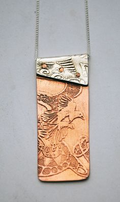 "This copper and silver Magpie necklace is made up of two etched and impressed pieces of metal and riveted together with handmade copper rivets.  The top part of this copper and silver Magpie pendant is made from sterling silver which has been impressed from an etched brass plate of my own hand drawn ink drawing.  The bottom part is etched with a flying magpie motif and polished to a mirror finish.  All my designs are original limited editions. supplied on sterling silver 16\" or 18\" curb chain Cold Connection Jewelry Ideas, Copper And Silver Jewelry, Etched Metal Jewelry, Rivet Jewelry, Cold Connections, Etched Jewelry, Metal Jewellery, Etched Copper, Metal Etching