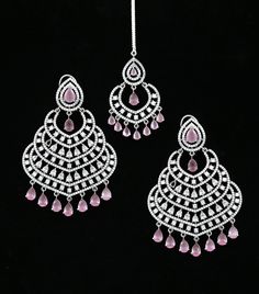 This beautiful Silver American Diamond Chandbali Earring Tikka set features silver tone Rhodium plating and is adorned with sparkling American diamonds. Perfect for Indian weddings, Bollywood fashion, Punjabi style Chandbali, and Pakistani weddings, this jewelry set will give you the perfect glamorous look. Diamond Chandbali, Indian Jhumka, Punjabi Style, Chandbali Earrings, Indian Weddings, Kundan Necklaces, Indian Bollywood, Jhumka Earrings, Cz Jewelry