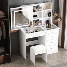 a white dressing table with mirror and stool