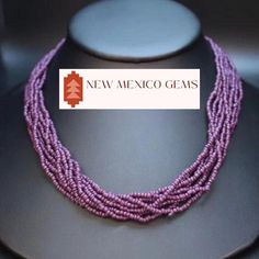 This is a southwest glass seed bead multi-strand necklace. These beads are dark plum purple.  Dress up your outfit with a minimalist traditional mixed hand- beaded necklace.  * 10 strands of plum colored glass seed beads * adjustable from 18" - 21"long * hand beaded in New Mexico * hook and eye clasp with extender * Gift boxes available for purchase shown in photos. * Also comes in a nice presentation box. Check out the rest of our collection: https://www.etsy.com/shop/NewMexicoGems Bohemian Purple Polished Beads, Traditional Purple Beaded Necklace With Round Beads, Purple Multi-strand Bohemian Beads, Purple Multi-strand Beaded Necklace, Bohemian Purple Beaded Necklaces With Polished Beads, Bohemian Multi-strand Purple Beads, Purple Bohemian Multi-strand Beads, Bohemian Purple Multi-strand Beads, Purple Multi-strand Beads For Jewelry Making