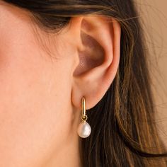 D A N G L I N G ∙ P E A R L ∙ H U G G I E S Radiate refined sophistication with our Dangling Freshwater Pearl Hoops, a symbol of purity and love. These pearl earrings add grace and classic charm to your everyday outfits. Adorn yourself in effortless elegance with every sway ✨ * Material: High Quality Solid 925 Sterling Silver  * Finish: Sterling Silver ∙ 18K Gold * Hoop Dimensions: ~6.5mm Inner Diameter | ~10.5mm Outer Diameter * Featuring Link Huggie Hoop Earrings with a dangling Freshwater Pea Elegant Wedding Jewelry, Drop Hoop Earrings, H U, Earrings Elegant, Pearl Charms, Pearl Stud Earrings, Pearl Studs, Elegant Earrings, Pearl Drop