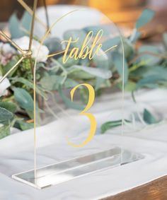 the table numbers are placed on clear acrylic