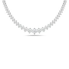 Let this ribbon of diamonds encircle your neck with regal elegance. This tennis necklace features a line of brilliant diamonds meticulously set in two-prong baskets. A larger diamond sits at the center of the strand and gradually tapers in size as it moves away from the center. Anniversary Tennis Necklace In Diamond White With Brilliant Cut, Elegant Baguette Cut Diamond Necklace In Prong Setting, Classic Diamond White Necklaces With Diamond Accents, Timeless Diamond White Necklace With Prong Setting, Fine Jewelry Diamond White Tennis Necklace For Anniversary, Formal Solitaire Diamond Necklace With Baguette Cut, Formal Solitaire Necklace With Baguette Cut Diamond, Bridal Diamond Necklace With Round Prong Setting, Elegant Necklace With Prong Setting And Lab Grown Diamonds