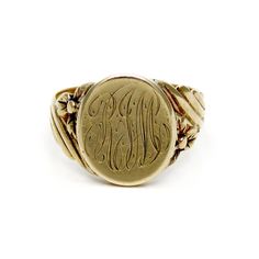 Presented is a wonderful antique 14 karat yellow gold signet ring. This ring dates to the early 1900s and was made in America. The head of the ring is round, with a finely engraved monogram of RJM, done in flowing script. The gold is quite thick, so this monogram could be removed by a professional jeweler, and replaced with your own initials, crest, seal, or whatever else you like. The shoulders of the ring have an elegant spiral design, with a little trefoil on either side, nicely detailed with Antique Jewelry Rings, Gold Signet Ring, Spiral Design, Ring Pictures, Early 1900s, Made In America, Hand Engraving, Signet Ring, Vintage Watches