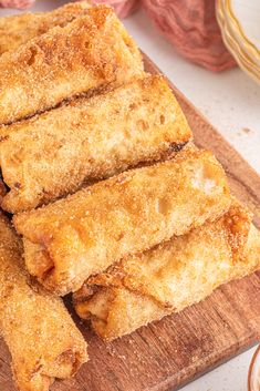 some fried food on a wooden cutting board