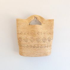 IN STOCK NOW SHIPPING FROM LOS ANGELES Embrace summer vibes with the Elena Handbags Hand Woven Fashion Raffia Beach Bag. This trendy handbag is made from raffia and features a hand woven design, perfect for a day at the beach. Stand out with this unique and stylish fashion accessory. Natural Soft Raffia Straw Handmade Woven Rectangular Vacation Bag, Handheld Woven Crochet Bag For Vacation, Handheld Crochet Bag For Vacation, Vacation Top Handle Woven Crochet Bag, Handwoven Natural Bucket Bag For Beach Season, Bohemian Beach Bag In Natural Fiber For Vacation, Natural Handwoven Bucket Bag For Beach Season, Bohemian Natural Bucket Bag For Summer, Handwoven Natural Fiber Bucket Bag For Vacation