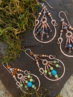 Beautiful Copper beaded Tassle earings.  With a gorgeous hammered face Sweet lashed wire weaves  And hand made ear wires.  So much detail This set is the green pair  But all handmade items in my shop can be custom ordered for different colours, shapes and stones.  With love  DQ Handmade Copper Wire Wrap Drop Earrings, Handmade Copper Wire Drop Earrings, Bohemian Wire Wrapped Earrings For Jewelry Making, Bohemian Wrap Earrings With Ear Wire, Artisan Handmade Earrings With Copper Wire, Artisan Handmade Earrings In Copper Wire, Artisan Handmade Copper Wire Earrings, Bohemian Hand Wrapped Dangle Earrings, Bohemian Hand-wrapped Dangle Earrings