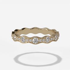 a gold ring with diamonds on it