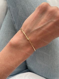 All Our Bracelets Are Made Of REAL 14K GOLD  14K yellow Gold Love Knot Cuff Bangle Bracelet, Real Gold Bangle, Stackable Bangle, Women  Shop our 14K Bracelets https://www.etsy.com/shop/GOLDMANIA?ref=seller-platform-mcnav§ion_id=26925987  Shop On Sale items https://www.etsy.com/shop/GOLDMANIA?ref=seller-platform-mcnav§ion_id=1  Metal: 14K Yellow Gold    Width: 2 MM  Length: 7 IN  Closure: Cuff Weight: 2.80 Gram   Knot dimension: 5 mm   SHIPPED FROM NEW YORK CITY FREE SHIPPING on all orders IN THE Adjustable Yellow Gold Bangle For Anniversary, Adjustable Cuff Bracelet For Anniversary, Fine Jewelry Style, Gold Cuff Bracelet For Anniversary, Adjustable Cuff Bracelet For Anniversary In Fine Jewelry Style, Adjustable 14k Gold Bangle For Wedding, Adjustable Fine Jewelry Cuff Bracelet For Anniversary, Gold Plated Bangle For Anniversary, Yellow Gold Jubilee Cuff Bracelet For Wedding, Yellow Gold Bangle Jewelry For Gift