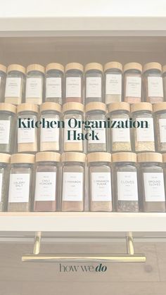 the kitchen organization hack book is open on top of a shelf filled with jars and spices