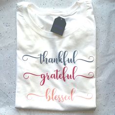 a white t - shirt with the words grateful and thank written on it