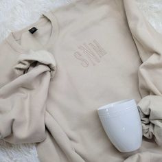 Stay warm and cozy in this monogrammed sweatshirt.Perfect sweatshirt for a day of errands, walking to class or a cozy day at home. Pair with your favorite jeans or leggings to complete your look.  Pictured is the Sand color sweatshirt with style A Font in the Ivory thread color. SWEATSHIRT DESCRIPTION 80/20 ring-spun cotton/polyester ▹ Shirts are UNISEX FIT, not Ladies - please check size chart! ▹ Shirts are standard length, NOT tunic length ORDERING INSTRUCTIONS SELECT COLOR & SIZE FROM THE DRO Relaxed Fit Letter Embroidery Sweater For Fall, Casual Cream Sweatshirt With Letter Embroidery, Fall Sweater With Embroidered Logo For Loungewear, Casual Sweatshirt With Custom Embroidery For Loungewear, Winter Loungewear Sweater With Embroidered Logo, Cozy Sweatshirt With Letter Embroidery For Fall, Fall Sweatshirt With Embroidered Logo For Loungewear, Winter Custom Embroidery Sweatshirt For Loungewear, Fleece Sweater With Letter Embroidery For Fall