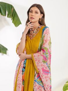 Featuring a multi coloured printed kaftan highlighted with mirrorwork on neckline. It comes with a slip. Color: Yellow Fabric: Viscose Cotton Silk, Chanderi Embroidery / Work Details: Mirrorwork Note: Wash Care - Dry Clean only The product will be delivered within 3-4 weeks of order placed Relaxed Fit Bottom not included woth the product Yellow Kaftan, Kaftan For Women, Printed Kaftan, Tropical Leaf Print, Tropical Leaf, Yellow Fabric, Tropical Floral, Embroidery Work, Batwing Sleeve