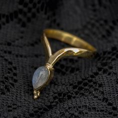 Pretty moonstone ring in gold colour made of brass. Available in a variety of sizes. We also have this design available with different gemstones: Labradorite, Amethyst or Turquoise. Please see our shop for details.For a size chart please go to www.ringsizes.co or send us a message if you have any questions about sizing. These are also available for wholesale.Do not hesitate to contact us if you have any questions or need more information. Like our facebook page for news and special offers:www.fa Bohemian Gold Rings With Gemstones, Handmade Bohemian Yellow Gold Midi Rings, Bohemian Gold Moonstone Ring For Gift, Bohemian Gold Moonstone Ring For Wedding, Bohemian Gold Moonstone Ring Gift, Bohemian Gold Stackable Rings, Bohemian Hand Forged Brass Rings, Gold Bohemian Stackable Rings, Gold Bohemian Moonstone Ring Gift