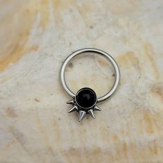 One (1) New Captive Bead Ring With Black Onyx Inset Stone Surrounded With Spikes. Surgical Steel Cbr Size: 16g - 12 Mm - 1/2" All Jewelry Is Brand New. If You Have Any Questions At All, Please Let Us Know. If You Have Had A Reaction To A Material In The Past, We Do Not Recommend Ordering Or Wearing Any Jewelry Made With That Material As It Could Cause A Reaction. All Jewelry Should Be Removed When Showering Or Swimming As Harsh Chemicals Such As Abrasive Soaps, Shampoos, Chlorine, Etc., May Caus Captive Bead Septum, Black Sterling Silver Punk Rings, Edgy Round Metal Jewelry, Nickel-free Metal Body Jewelry, Nickel-free Black Punk Jewelry, Silver Stainless Steel Body Jewelry, Black Nickel-free Punk Jewelry, Nickel-free Silver Stainless Steel Body Jewelry, Silver Punk Jewelry With Metal Ring