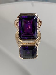 Ladies Womens Custom Luxury Handcrafted Rectangular Amethyst & Round Diamond Statement Ring 14 Karat Solid Yellow Gold Stamped Jewellery Ring Size: 6 and 1/4 US (can be adjusted to any finger size) Total Weight: 10.3 grams 24 round brilliant cut diamonds  1 Deep Purple Genuine Amethyst measuring approximately 18mm by 11mm Luxury Purple Amethyst Ring, Rectangular Shape, Luxury Purple Amethyst Rectangular Ring, Luxury Purple Rectangular Amethyst Ring, Luxury Rectangular Jewelry With Gemstone Accents, Rectangular Amethyst Ring In Yellow Gold, Yellow Gold Amethyst Ring With Rectangular Shape, Fine Jewelry With Rectangular Gemstone Accents, Fine Jewelry With Gemstone Accents Rectangular Shape, Formal Purple Amethyst Ring With Rectangular Shape