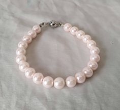 "WARM PROMPT: The correct measurement of the length of the bracelet is:the length of the wrist +0.5-1 inch = the length of the bracelet. PREFERENTIAL POLICIES : The order is $25 or more.There will be a 10% discount. Please use the coupon code: CZH10 Welcome back to my shop: https://www.etsy.com/shop/pearlandjewelry Description of the product in the picture: I make the necklace bracelet and stud earring to use 8mm light pink glass pearls. The necklace lengh is 18 inches,The bracelet lengh is 8 in Pink Pearl Bracelet For Wedding, Adjustable Pink Pearl Bracelet With Pearl Drop, Elegant Pink Hypoallergenic Bracelet, Pink Pearl Drop Bracelet For Wedding, Pink Beaded Pearl Bracelet For Wedding, Wedding Beaded Pink Pearl Bracelet, Adjustable Pink Pearl Bracelet For Weddings, Pink Hypoallergenic Bracelets For Wedding, Elegant Pink Pearl Bracelet With Round Beads