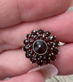 Vintage Bohemian GARNET Ring US 6.25 in Sterling Silver. Stamped "Silver" on the inside. Was certainly gold plated Sterling  Vermeil ( gold wash).. looks silver but may be some remnants of gold wash. Truly beautiful antique garnet cluster ring! Excellent condition . Makes a beautiful unique gift.  Will come in a small red ring box ready to gift.  Free shipping in the USA. All sales final . Vintage Garnet Cluster Ring As Gift, Garnet Ring With 17 Jewels, Collectible Garnet Ring Jewelry, Collectible Garnet Gemstone Ring, Collectible Garnet Ring, Antique Garnet Gemstone Jewelry, Vintage Multi-stone Garnet Jewelry, Antique Garnet Jewelry For Anniversary, Garnet Cluster Jewelry For Anniversary