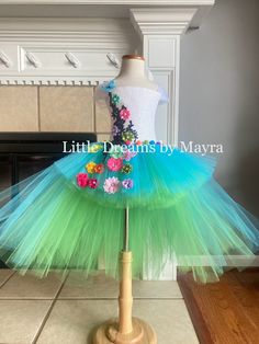 Welcome to Little Dreams by Mayra This dress is absolutely adorable and puffy! Just perfect for any birthday party, halloween, pageant or any occasion , your little one will look just adorable! Dress has three layers of tulle, Top has a handmade design in the front of the top only *If you need a different color just send me a message When selecting length you will select the longer layer in the back from armpit to floor, the front of the dress is shorter, if you wish to have the whole dress one length just let me a note at checkout  5'' crochet top will be used for sizes nb to 2T 8'' crochet top will be used for sizes 3T to 8years 10''crochet top will be used for sizes 9-10years 12''crochet top will be used for sizes 12years Shipping My orders are usually ready to ship in 7 business days, Playful Fairy Dress For Spring Party, Playful Spring Fairy Dress For Party, Spring Party Fairy Dress In Playful Style, Fitted Fairy Dress For Spring Pageant, Summer Fairy Dress With Tulle Skirt, Spring Fairy Style Tutu Dress With Tulle Skirt, Cute Fairy Dress For Costume Party, Spring Princess Dress In Tulle For Costume Party, Cute Fitted Fairy Dress For Costume Party