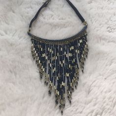 Free People Navy Fringe Necklace So Full Of Fringe, This Stunning Glass Beaded Necklace Is Featured In A Collar Style With Dangling Tassels And Metal Embellishments. Adjustable Fit Clasp Closure Blue Bohemian Necklaces For Party, Bohemian Blue Beaded Necklace, Blue Necklaces With Black Beads For Festival, Blue Necklace With Black Beads For Festival, Adjustable Bib Necklaces With Dangling Beads For Parties, Adjustable Bib Necklace With Dangling Beads For Party, Adjustable Gold Beaded Fringe Necklace, Adjustable Blue Beaded Necklaces For Party, Party Bib Necklaces With Dangling Beads