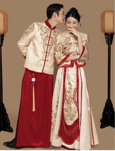 a man and woman dressed in traditional chinese clothing