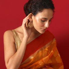 About the Jewelry Looking for earrings that give you a traditional look with a pinch of the modern Indian chic? Kalpa is what you need. Crafted beautifully with various patterns and texture these chaandbalis makes you look elegant in the best way possible. Styling Tip A semi-ethnic attire or a tunic will go perfectly with these earrings. Details & Specifications: Materials used: Brass Metal with Antique Plating Weight - Earrings 21 gm Length - Earrings 6 cm Make it custom Want to make it a custo Elegant Chandbali Earrings For Puja, Elegant Earrings For Puja And Diwali, Elegant Latkans Earrings For Puja, Elegant Earrings For Diwali Puja, Elegant Danglers For Puja, Festive Latkan Earrings For Puja, Fusion Style Earrings For Diwali Puja, Festive Fusion Earrings For Puja, Fusion Style Chandbali Earrings For Puja