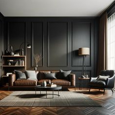 a living room with black walls and leather furniture