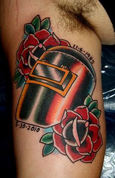 a chest tattoo with a rose and an open casket on it's left arm