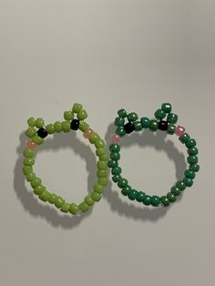 two beaded bracelets sitting next to each other