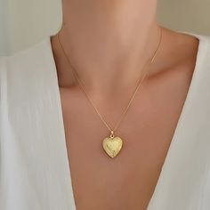 Heart locket necklace. Wear it on it's own or layer it. * we are not able to print your photo at the moment. you can cut out your own picture or order it online from site like postsnapPendant details: * Material: non tarnish gold filled* Measurements: 1.1' H 0.75' WChain: 18K gold filledComes in our gift ready packaging: vegan leather pouch for safe jewelry storing and branded box Gold Heart-cut Locket Necklace For Gift, Heart-shaped 14k Gold Locket Necklace Gift, Yellow Gold Open Heart Locket Necklace Keepsake, Gold Heart Locket Necklace, Heart-shaped Engraved Brass Locket Necklace, Heart-shaped Brass Locket Necklace For Gifts, Gold Heart Locket, Heart Locket Necklace, Gold Heart Necklace