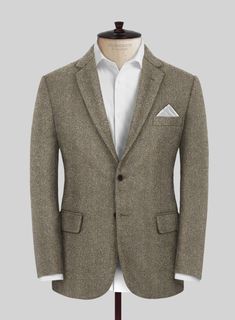 Wrap yourself in the epitome of luxury and timeless design with our Italian Highlander Stone Beige Herringbone Tweed Suit. Meticulously crafted from pure wool, this exquisite fabric marries unparalleled craftsmanship with the robust essence of the highlands. The subtle stone beige hue, interwoven with the classic herringbone pattern, offers a versatile and sophisticated choice for bespoke tailoring. Perfect for making a refined statement at business meetings, upscale social gatherings, or any ev Formal Tweed Blazer With Suit Collar, Formal Tailored Tweed Sport Coat, Tailored Tweed Sport Coat For Formal Occasions, Tweed Herringbone Suit For Tailoring, Timeless Tailored Tweed Blazer, Tailored Timeless Tweed Blazer, Elegant Tweed Sport Coat With Suit Collar, Formal Tweed Jacket With Welt Pockets, Fitted Wool Tweed Jacket With Pressed Crease