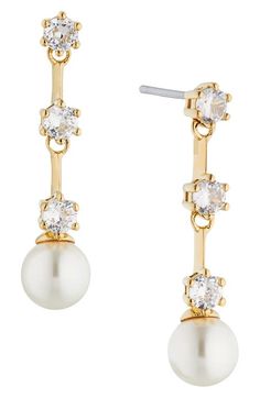 "Find NADRI Olivia Linear Drop Earrings on Editorialist. A line of prong-set cubic zirconia trickles down to a luminous imitation pearl in these hand-polished drop earrings that exude contemporary elegance. 1\" drop; 1/4\" width; 6mm pearls Rhodium plate or goldtone plate/cubic zirconia/imitation pearl Imported" Earrings In Gold, Gold Drop Earrings, Rhodium Plated, Prong Setting, Gold Earrings, Cubic Zirconia, Gold Tones, Things To Wear, Jewelry Earrings