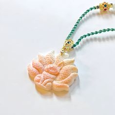 Pink Shell 粉贝 Nine Tailed Fox 九尾狐 Pendant 吊坠 Traditional Shell Jewelry As Gift, Traditional Shell Jewelry Gift, Pink Adjustable Jade Jewelry, Pink Jade Jewelry With Natural Stones, White Jade Amulet Jewelry, White Carved Spiritual Jewelry, White Resin Pendant Jewelry, White Amulet Jewelry With Natural Stones, White Shell Jewelry With Natural Stones