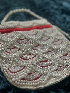 Red evening bag with elegant beadwork; perfect for weddings, parties and special occasions. Beaded Rectangular Potli Bag For Festive Occasions, Festive Beaded Rectangular Potli Bag, Festive Rectangular Beaded Potli Bag, Festive Beaded Evening Bag As Gift, Festive Beaded Shoulder Bag As Gift, Festive Beaded Shoulder Bag For Gifts, Festive Beaded Shoulder Bag Gift, Festive Beaded Evening Bag For Gift, Festive Beaded Shoulder Bag