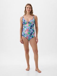 Soft, stretch maternity one-piece swimsuit.  V-neck.  Tank straps at front, strappy details at back.  Certain styles have allover prints.  This one-piece is made with 83% recycled polyester.  Less waste in the world.  More great swimsuits for you.  Please note: Maternity styles cannot be returned in store.  Please enjoy free returns by mail.  Choose your maternity