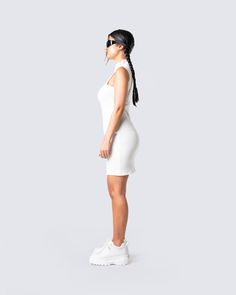 A little white dress is essential for the summertime 🤍 Made from a stretch rib knit, and designed with a mock neck detail, this dress is perfect for an everyday look, or a special night out. 🕊 Winter Ribbed White Mini Dress, White Ribbed Mini Length Sweater Dress, White Ribbed Stretch Bodycon Dress, Fitted White Knitted Mini Dress, White Fitted Ribbed Mini Dress, Fuzzy Skirt, Denim Pleated Skirt, Floral Lace Skirt, White Corset Dress