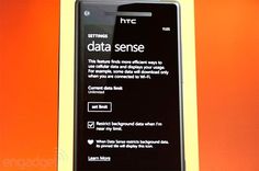 an htc cell phone with the text data sense on it's display screen