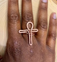 Gorgeous bare copper Ankh ring. Hand made and hand polished. Lightweight bright and smooth.  Each ring is made with beautiful light orange toned thick bare copper wire made from Peru.  Multiple sizes available- This ring is made to order and it may take up to 14 days to recive it. (3-5 days is the usual)  Comes with a free jewelry cleaning cloth. If you would like your ring oxidized for FREE, please send me a message before or right after making your order! Oxidizing will enhance your rings copp Adjustable Copper Spiritual Rings, Handmade Bohemian Rose Gold Ring, Handmade Rose Gold Bohemian Ring, Adjustable Copper Wire Wrapped Rings, Adjustable Copper Nickel-free Rings, Handmade Adjustable Copper Wire Rings, Unique Handmade Copper Rings, Adjustable Nickel-free Copper Ring, Handmade Copper Artisan Ring