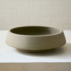 a white bowl sitting on top of a table