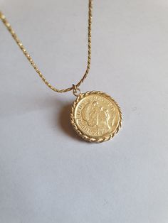 Solid gold coin necklace, gold coin pendant necklace, antique necklace, British coin gold necklace, 14k gold necklace Solid gold 14k necklace with an old british gold coin pendant, great for everyday wear, unique and beautiful. The chain is made of 14k solid gold and available in a few styles and lengths and the pendant is an original coin which I decorate with twisted gold wires and is available in 9k or 14k solid gold. Dimensions: The coin pendant's diameter is about 0.75 inch (2 cm). There ar Gold Coin Necklace Design, Tarnish-resistant Yellow Gold Coin Necklace, Yellow Gold Plated Coin Necklace, Yellow Gold Plated Necklace With Coin Pendant, 14k Gold Necklace With Coin Pendant, 14k Yellow Gold Necklace With Coin Pendant, 14k Gold Necklace With Round Coin Pendant, Classic Yellow Gold Medallion Necklace With Coin Pendant, Vintage Yellow Gold Coin Necklace, Tarnish Resistant