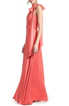 A satin tie at the neck and a pleated waist elevate the elegance of a flowy formal gown you'll feel gorgeous in at your next event. 57" center front length (size 8) Hidden side-zip closure Ties at neck Halter neck Sleeveless, with cutaway shoulders Lined 100% polyester Dry clean Imported Asian Owned/Founded Coral Satin Dress, Coral Ball Gown, Elegant Peach Floor-length Gown, Designer Peach Floor-length Dress, Coral Gown, Elegant Hand-strung Coral Necklace, High Neck Gown, Cobalt Blue Dress, Halter Gown