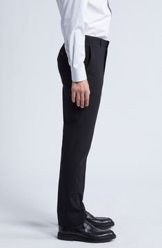 Smart and versatile, these dress pants tailored from polished wool feature a touch of stretch to keep you moving comfortably at any formal occasion. 36 1/2" inseam; 15" leg opening; 9 1/2" front rise; 15" back rise (size 30) Zip fly with hook-and-bar closure Front slant pockets 96% wool, 4% elastane Dry clean Imported Elegant Ankle-length Dress Pants With 4-way Stretch, Elegant 4-way Stretch Ankle-length Dress Pants, Elegant Ankle-length 4-way Stretch Dress Pants, Business Trousers Made Of Elastane, Business Straight Pants With Elastane, Stretch Elastane Pants For Semi-formal Occasions, Business Straight Leg Elastane Pants, Black Business Dress Pants With Welt Pockets, Black Dress Pants With Welt Pockets For Business