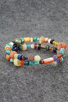 This beaded turquoise, coral, lapis, amber spiny oyster, mother of pearl, abalone, jasper, onyx and amethyst stretchy wrap bracelet was expertly crafted by Navajo artisan Helen Tsosie.Circumference: 5 1/2" (adjustable)Width: 1/2"Free shipping on all orders! We ship with USPS and always include tracking. All orders ship within a day of payment.Returns are accepted up to 30 days after you receive your order. Just send us a message. Our shop offers cash back or store credit. The item must be returned in new condition. Instagram Jewelry, Bear Carving, Spiny Oyster, Pearl Chain, Multi Stone, Native American Jewelry, Free Jewelry, Stone Beads, Beaded Bracelet