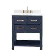 a bathroom vanity with marble top and two gold faucets on the sink area